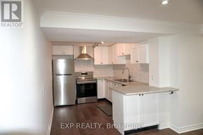 Newmarket (Glenway Estates) apartment for rent - A kitchen with white cabinets and a marble countertop.