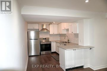 Newmarket (Glenway Estates) apartment for rent - A kitchen with white cabinets and a marble countertop.