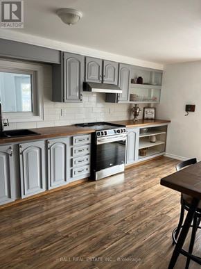 Asphodel-Norwood apartment for rent - A bathroom with a toilet, sink, and mirror.
