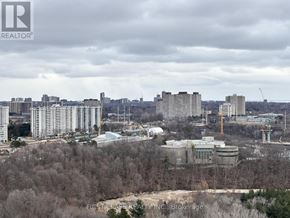 Toronto (Banbury-Don Mills) condo for rent - A cityscape with buildings and trees in the foreground.