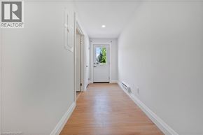 Kitchener apartment for rent - A long hallway with a door at the end.