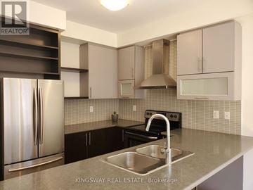 Brampton (Northwest Brampton) apartment for rent - A kitchen with a stainless steel refrigerator and a sink.