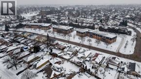 London apartment for rent - A snowy residential area with houses and apartment buildings.