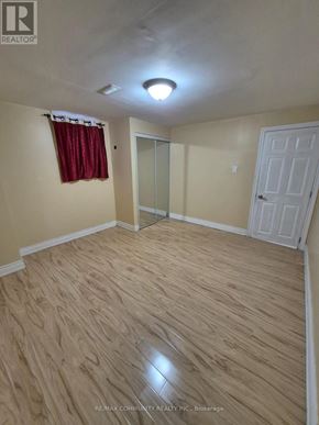 Ajax (Northwest Ajax) apartment for rent - A room with a wooden floor and a white door.