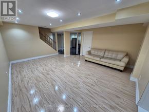 Ajax (Northwest Ajax) apartment for rent - A living room with a couch and a staircase.