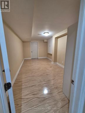 Ajax (Northwest Ajax) apartment for rent - A hallway with wood flooring and white doors.