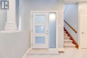 Oakville (Jc Joshua Creek) townhouse for rent - A white door with a glass panel is in the center of a hallway.