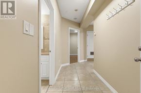 Hamilton (St. Clair) multi-family for rent - A hallway with a door on the right and a white door on the left.