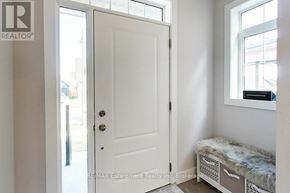 Blue Mountains apartment for rent - A white door with a glass window is in a room with a window and a bench.