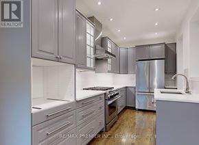 Vaughan (Patterson) apartment for rent - A modern kitchen with stainless steel appliances and wooden floors.