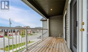 Barrie (Edgehill Drive) apartment for rent - A balcony with a wooden floor and a metal railing.