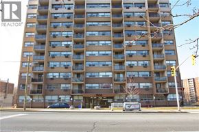 Hamilton condo for rent - A tall apartment building with the number 1500 on it.