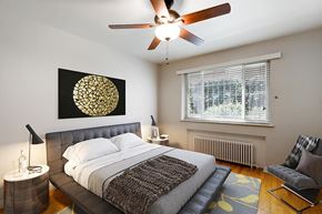 Denver apartment for rent - a bedroom with a bed and a ceiling fan