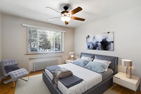 Denver apartment for rent - a bedroom with a bed and a ceiling fan