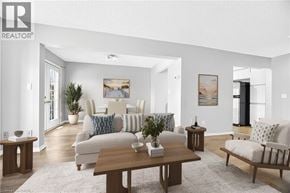 Stoney Creek townhouse for rent - A living room with a sofa set, a coffee table, and a painting on the wall.