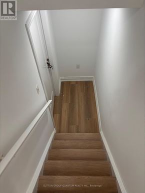 Brampton (Bram East) apartment for rent - A staircase with wooden steps and white walls.