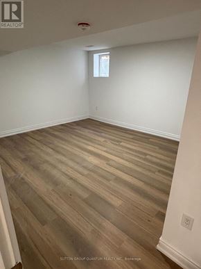 Brampton (Bram East) apartment for rent - A room with wooden flooring and a window.