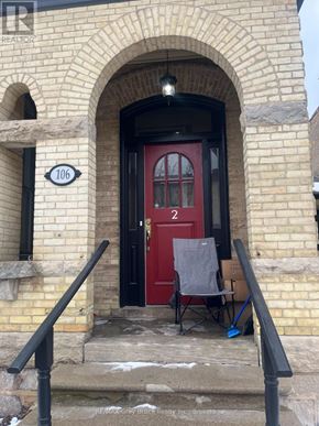 Arran-Elderslie apartment for rent - A red door with a sign that says 106 on the left.