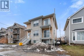 Cornwall triplex for rent - A row of houses with the middle one being the largest.