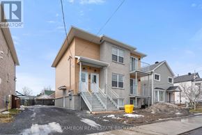 Cornwall triplex for rent - A two-story house with a garage is for sale.