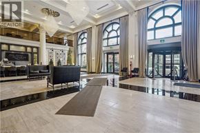 Hamilton condo for rent - A large, open lobby with a marble floor and a reception desk.