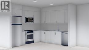 Guelph townhouse for rent - A white kitchen with a refrigerator, oven, and microwave.