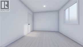 Guelph townhouse for rent - A white room with a door and a window.