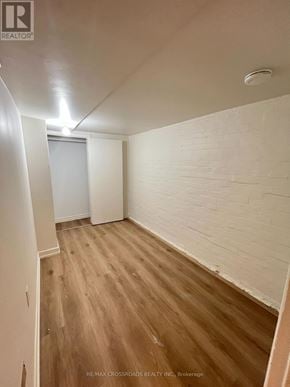 Toronto (South Riverdale) apartment for rent - A room with wooden flooring and white walls.