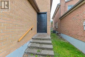 Vaughan (Crestwood-Springfarm-Yorkhill) apartment for rent - A black door is at the end of a concrete staircase.