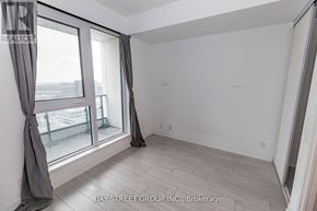 Vaughan (Vaughan Corporate Centre) condo for rent - A room with a large window and a view of the outside.