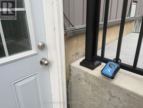 Thorold (Rolling Meadows) apartment for rent - A blue device is sitting on a ledge next to a door.