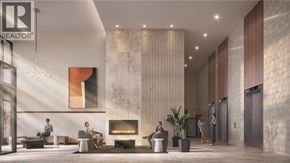 Kitchener condo for rent - A lobby with a fireplace and people sitting.