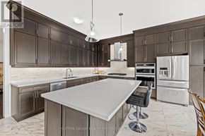 Brant (Paris) apartment for rent - A kitchen with a marble countertop and a large island.