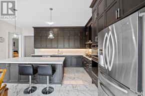 Brant (Paris) apartment for rent - A modern kitchen with a marble countertop and stainless steel appliances.