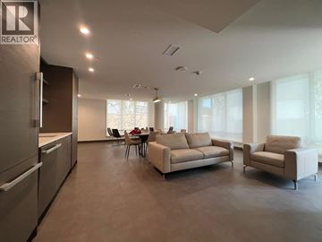 Vancouver apartment for rent - A spacious living room with a dining table and chairs.
