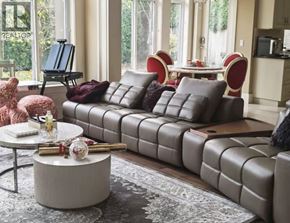 Richmond apartment for rent - A living room with a grey sofa and a round coffee table.