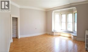 Chatham apartment for rent - A room with wooden floors and a window with sunlight coming through.