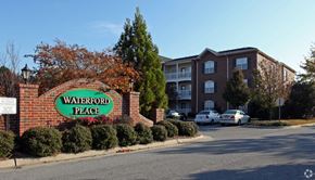 Greenville apartment for rent - A sign that says Waterford Place is in front of a brick building.
