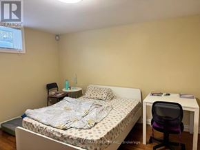 Toronto (L'amoreaux) apartment for rent - A bedroom with a bed, desk, and chair.