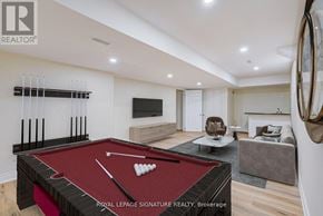 Milton (Co Coates) multi-family for rent - A pool table is in the middle of a living room.