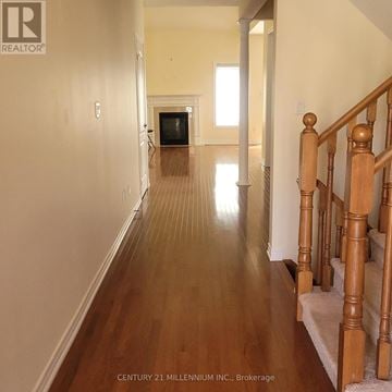 Brampton (Sandringham-Wellington) house for rent - A kitchen with wooden floors and black cabinets.