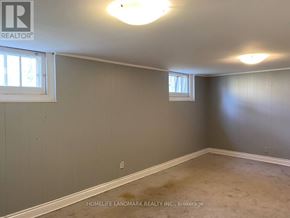 Toronto (East York) apartment for rent - A room with a window and a wall with a logo that says REALTOR.