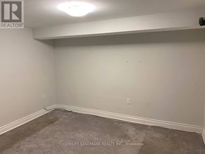 Toronto (East York) apartment for rent - A room with a carpeted floor and white walls.