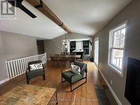 Blue Mountains apartment for rent - A living room with a wooden floor and a fireplace.