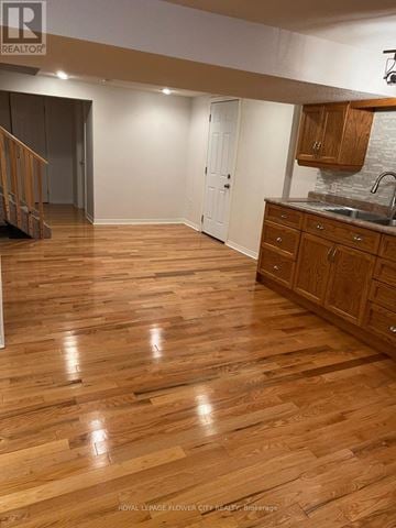 Whitby (Blue Grass Meadows) apartment for rent - A kitchen with wooden floors and white walls.