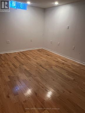 Whitby (Blue Grass Meadows) apartment for rent - A room with wooden flooring and white walls.