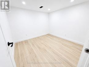 Toronto (West Hill) apartment for rent - A room with wooden flooring and white walls.