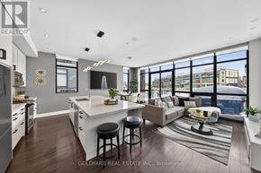 Innisfil townhouse for rent - A modern kitchen with a bar area and a view of the city.