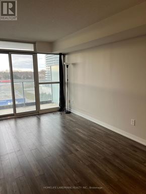 Toronto (Bayview Village) condo for rent - A room with a sliding glass door leading to a balcony.