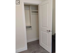 Burnaby apartment for rent - A white door is open to a small closet.